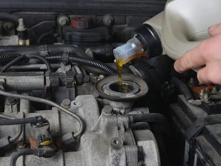 Auto Technician Performing Diesel Oil Change in St. George, UT