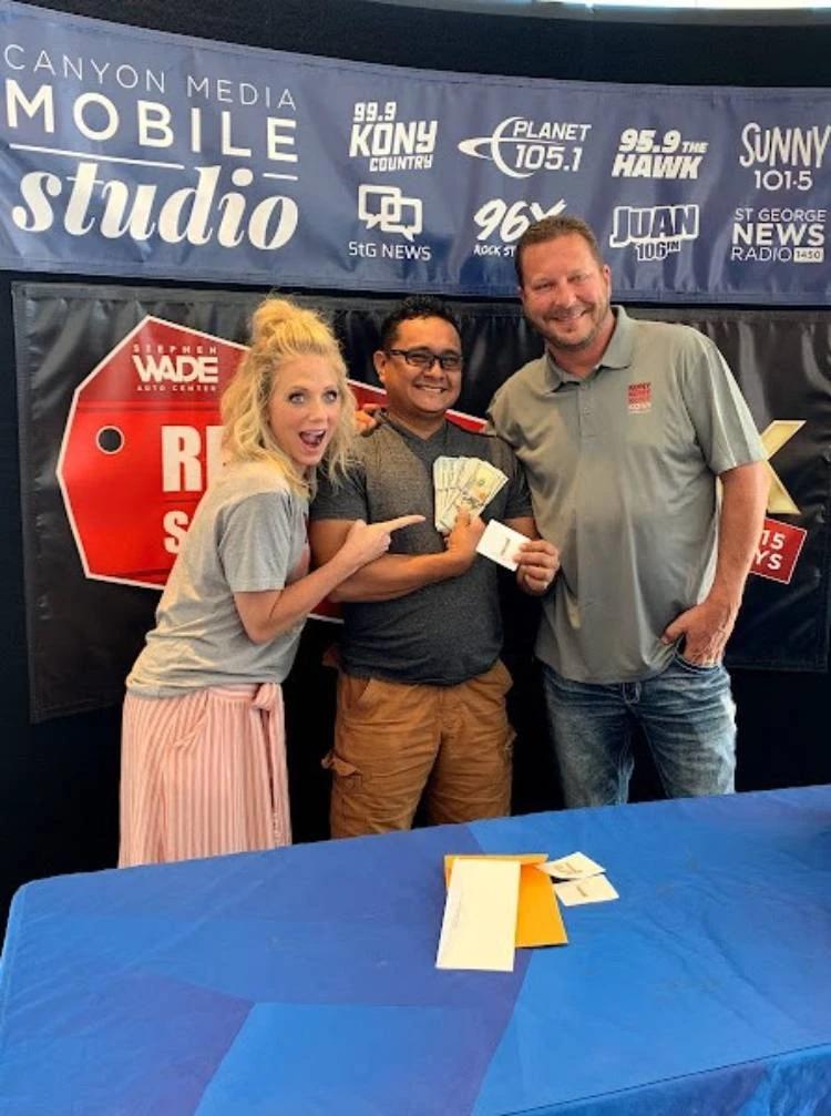 Man winning at Red Tag Sales Event of Stephen Wade in St. George, UT