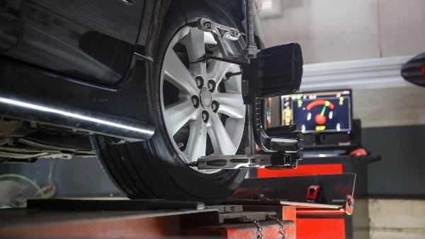 Car wheel undergoing alignment